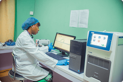 Technician operating the new molecular laboratory equipment at NFH