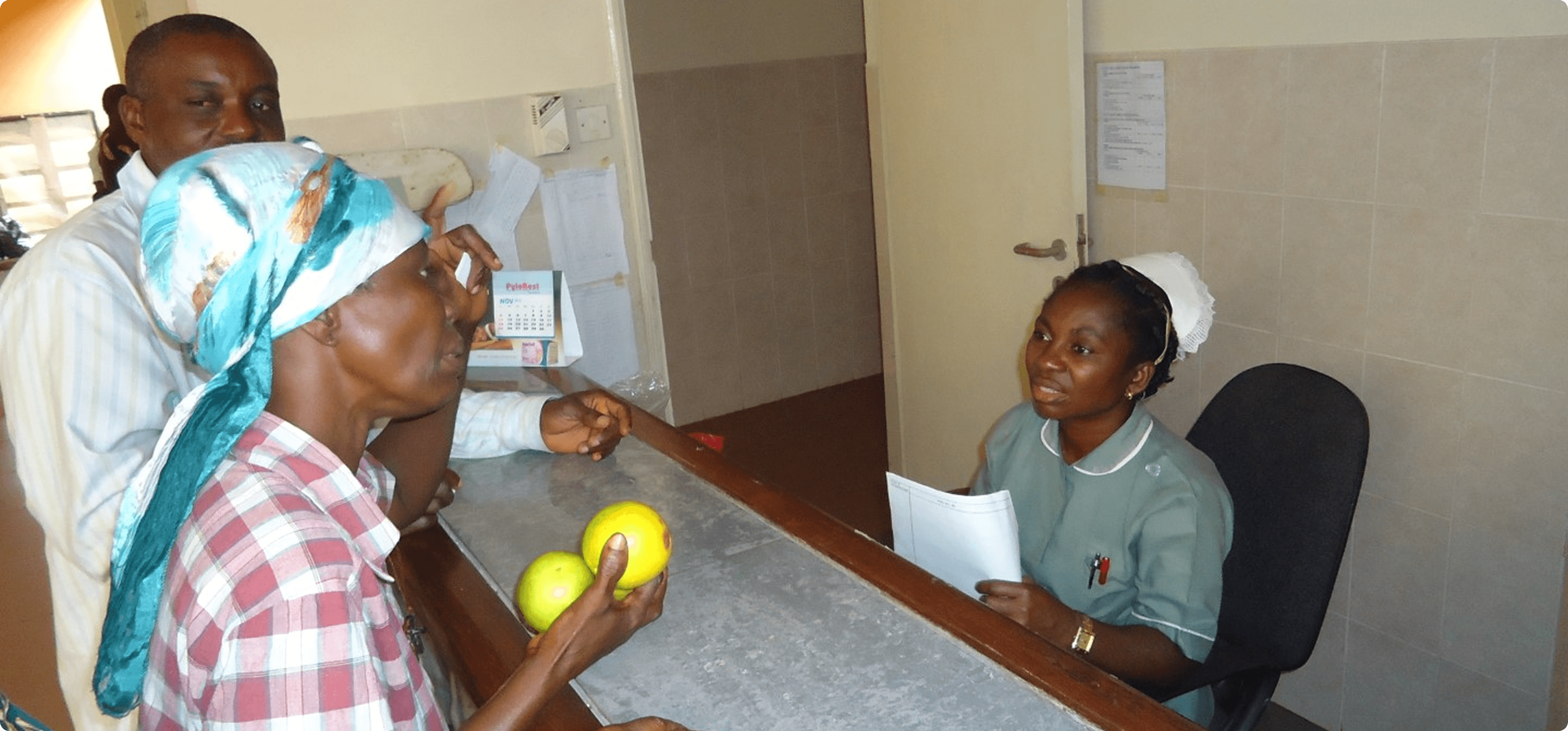 Pharmacist dispensing medicine at the Iwollo Rural Health Centre