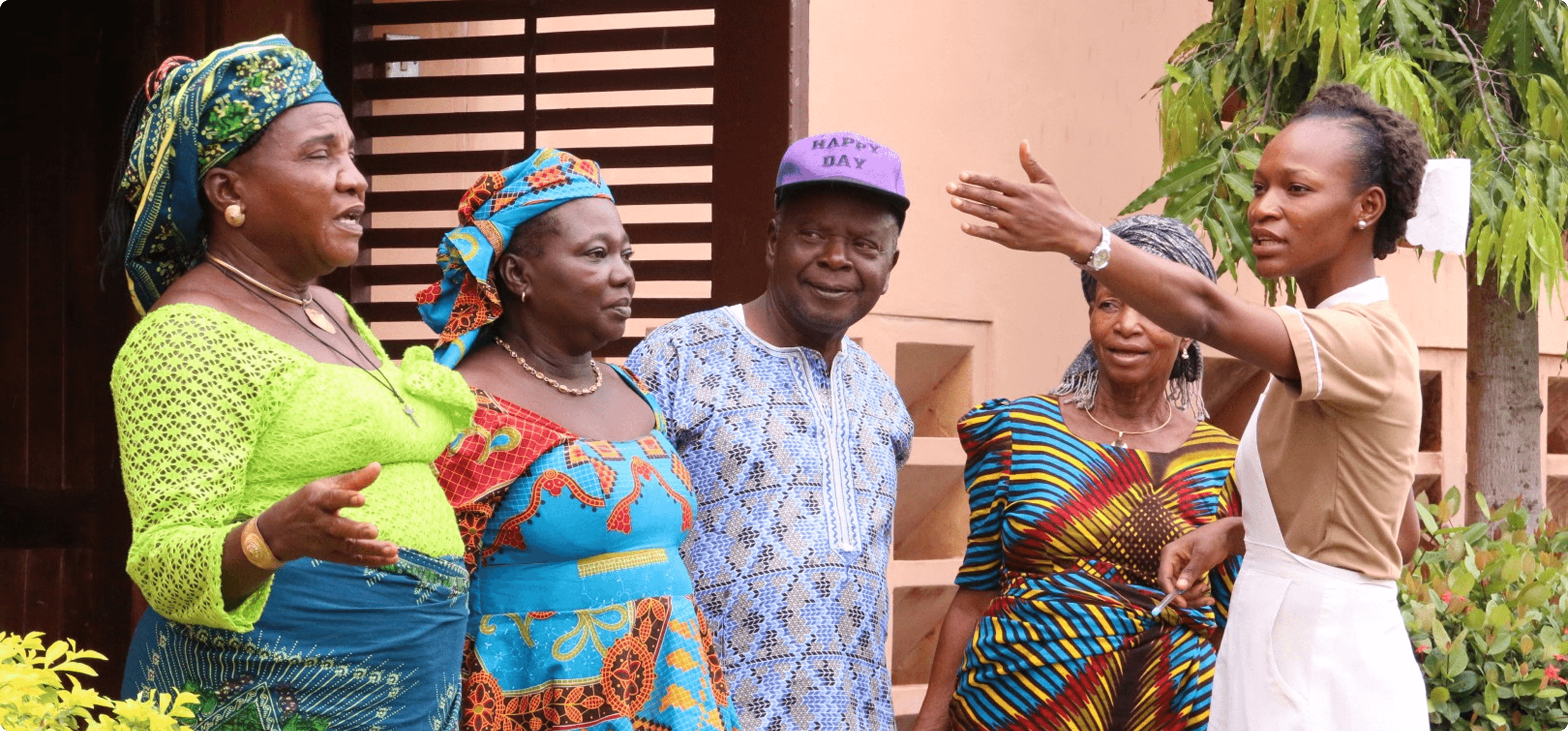 Health worker greeting women at the Iwollo Rural Health Centre outreach